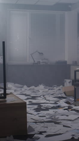 disorganized office with papers and smoke