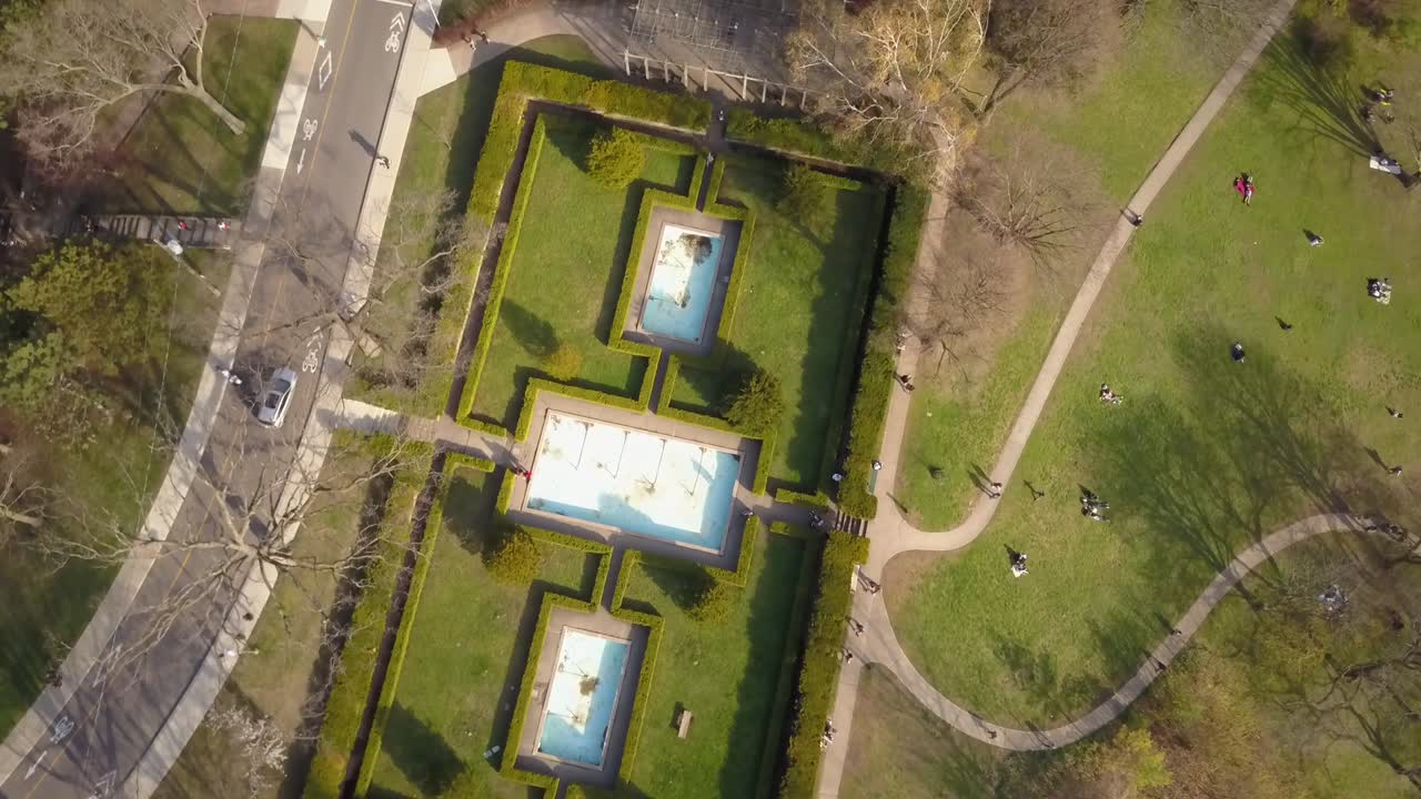 Aerial cinematic shot of fountain in a park