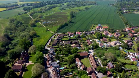 aerial footage from high altitude of a village near canterbury