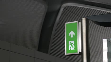 Green Emergency Exit Sign with Running Figure