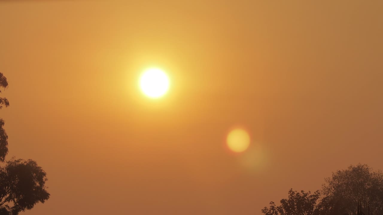 Early Sunrise Big Orange Sun Hazey Clear Sky Timelapse Australia Victoria Gippsland Maffra Medium Shot