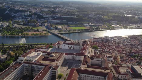 coimbra, portugal, focusing on the paço das escolas, university courtyard, and the mondego river - aerial