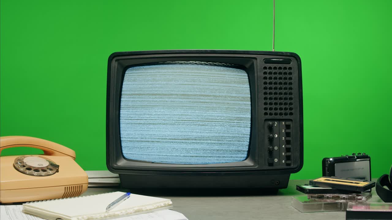 Retro Style TV Set with Green Screen chroma key background, vintage 60s analog television with grain and noise.