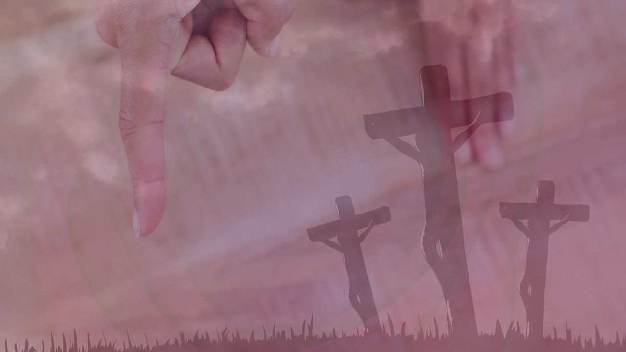 Index finger entering frame and descending over three wooden crosses showing graveyard silhouette