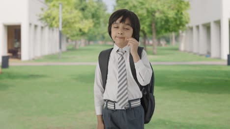 Tired-and-sleepy-Indian-school-boy-yawning