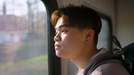 man traveling by train