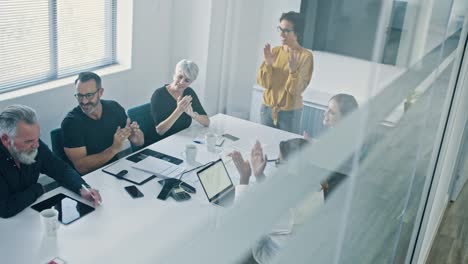 business team applauding after a productive meeting