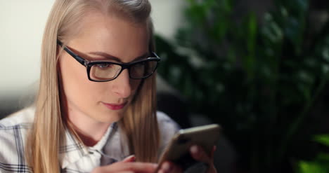 Businesswoman-Using-Wireless-Computer-At-Workplace-1