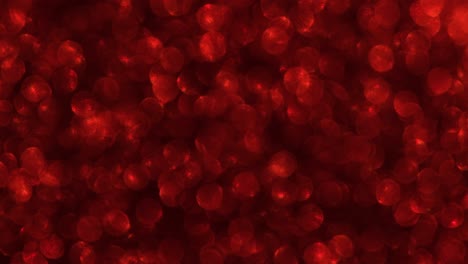fondo de video 4k de brillo brillante abstracto. fondo de brillo rojo con textura brillante. luz brillante de rubí, chispas de pañuelos y fondo de aluminio brillante.