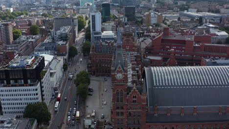 Slide-and-pan-aerial-footage-of-Victorian-style-brick-building-of--St-Pancras-train-station-and-hotel.-London,-UK