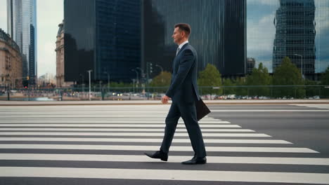 businessman walking on crosswalk in city