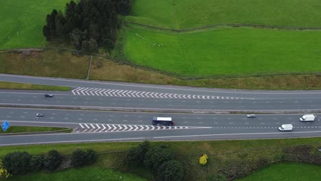 Busy-3-Lane-Motorway-in-Countryside,-Birds-Eye-View