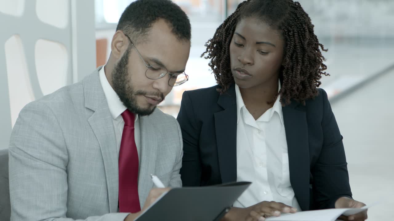 Business people signing contract