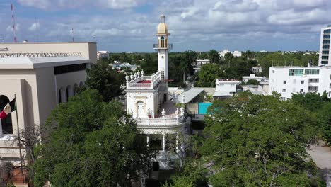 aerial trucking shot to the right of the el minaret mansion on the paseo de montejo in merida, yucatan, mexico