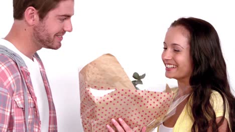 Man-offering-flowers-to-his-girlfriend