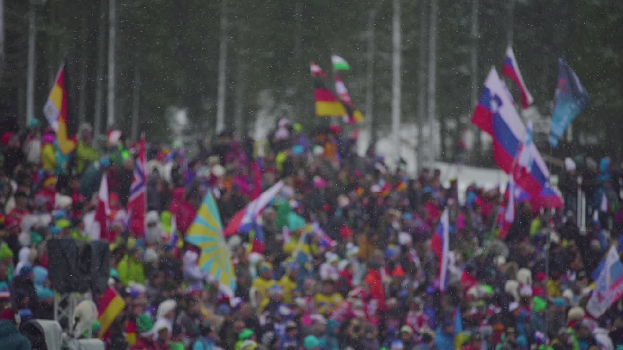 Winter Sports Event with Large Crowd and National Flags