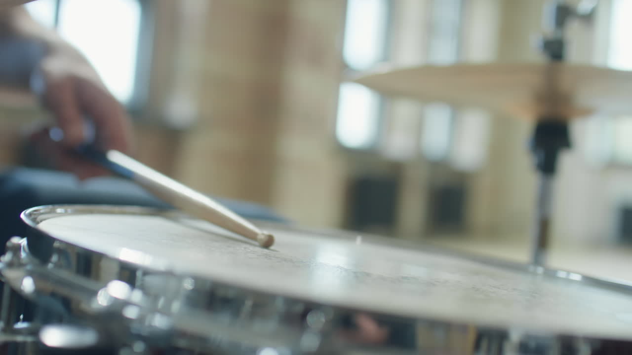 Drumsticks Hitting Drum