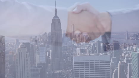 hand shaking animation over cityscape with tall skyscrapers in background