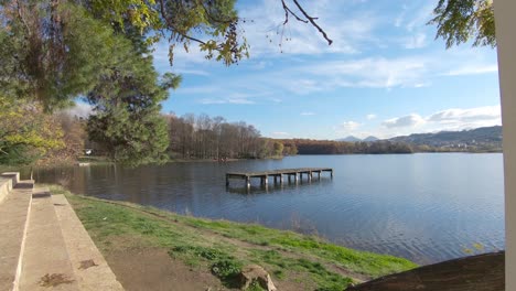 view from grand park stone gazebo to wooden pier on artificial lake in tirana, albania