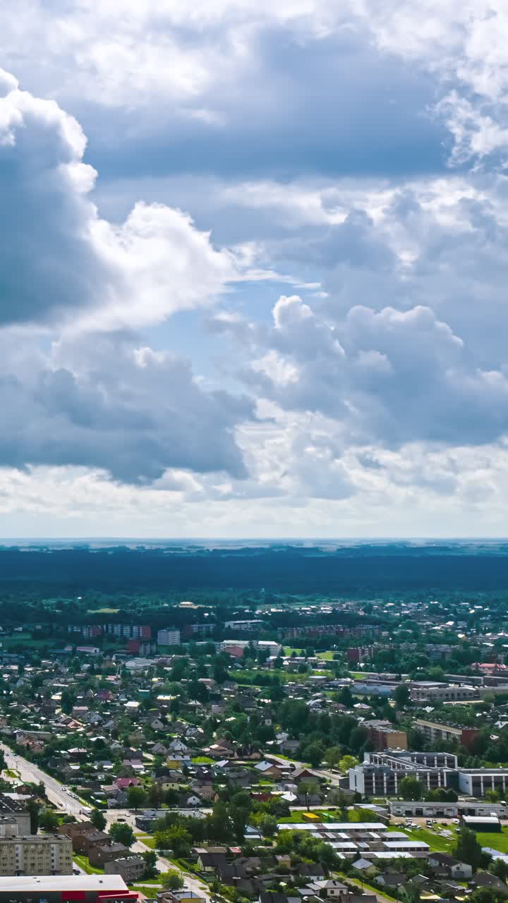 Timelapse of clouds over cityscape with vibrant mood