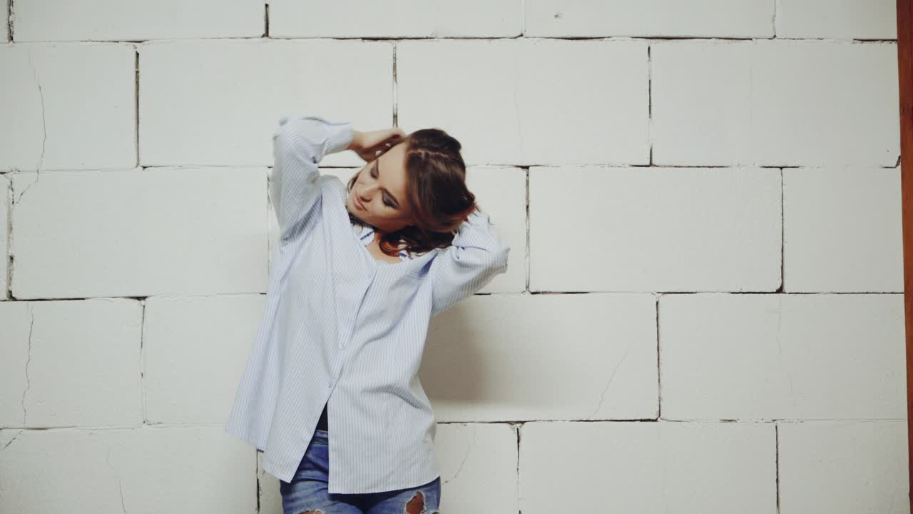 Portrait of glamour woman. Young fashionable woman posing in stylish wearing in studio