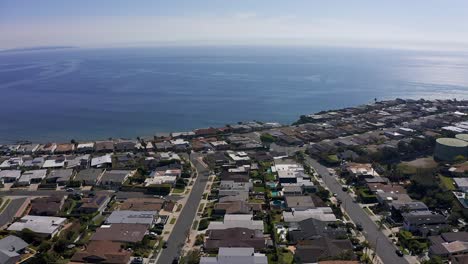 Descending-aerial-shot-of-a-neighborhood-on-the-bluffs-above-Malibu,-California