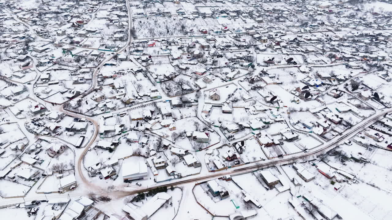 Aerial drone view of Butuceni village covered in snow. Old Orhei during winter in Moldova