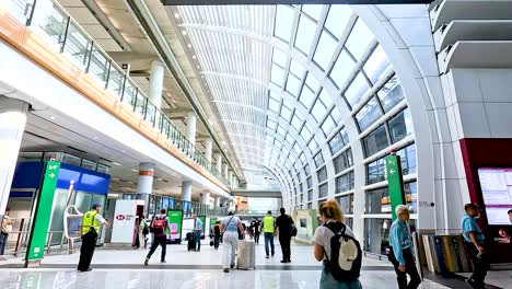 travelers and staff moving through airport terminal