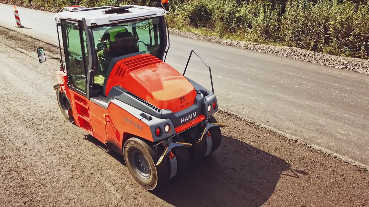 Heavy Vibration roller at asphalt pavement works. Construction of the road.