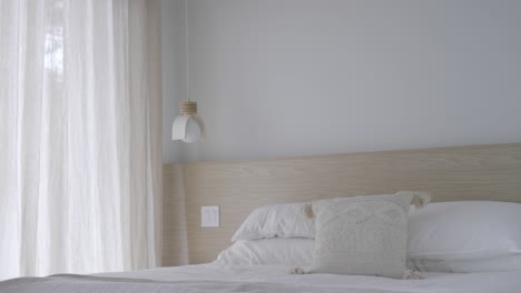 man with book sit on the bed to read