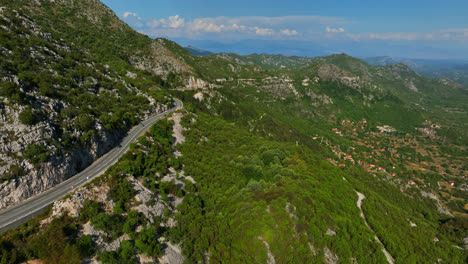 aerial traffic on a mountainside road, sunny, summer day in budva, montenegro