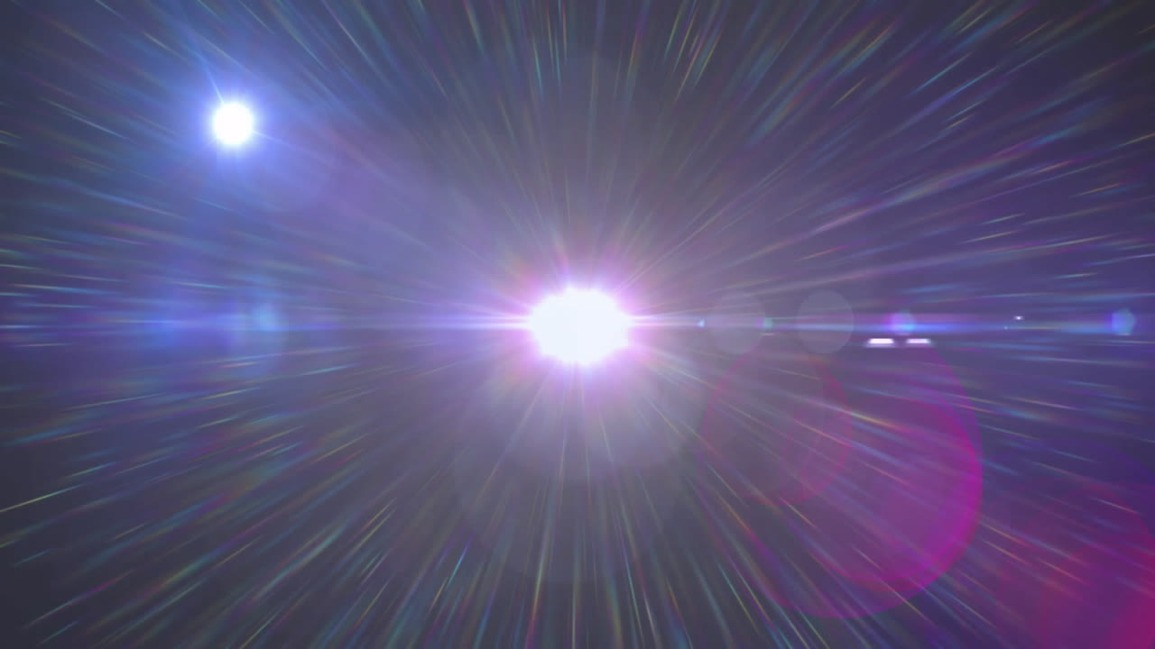 Central bright light source shining in dark backdrop, radiating multicolored radial streaks widely
