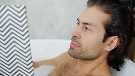 man reading in bathtub