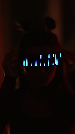 person holding a glowing led visualizer