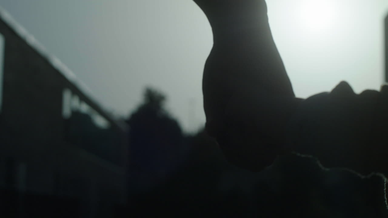 Silhouette of Hands in City