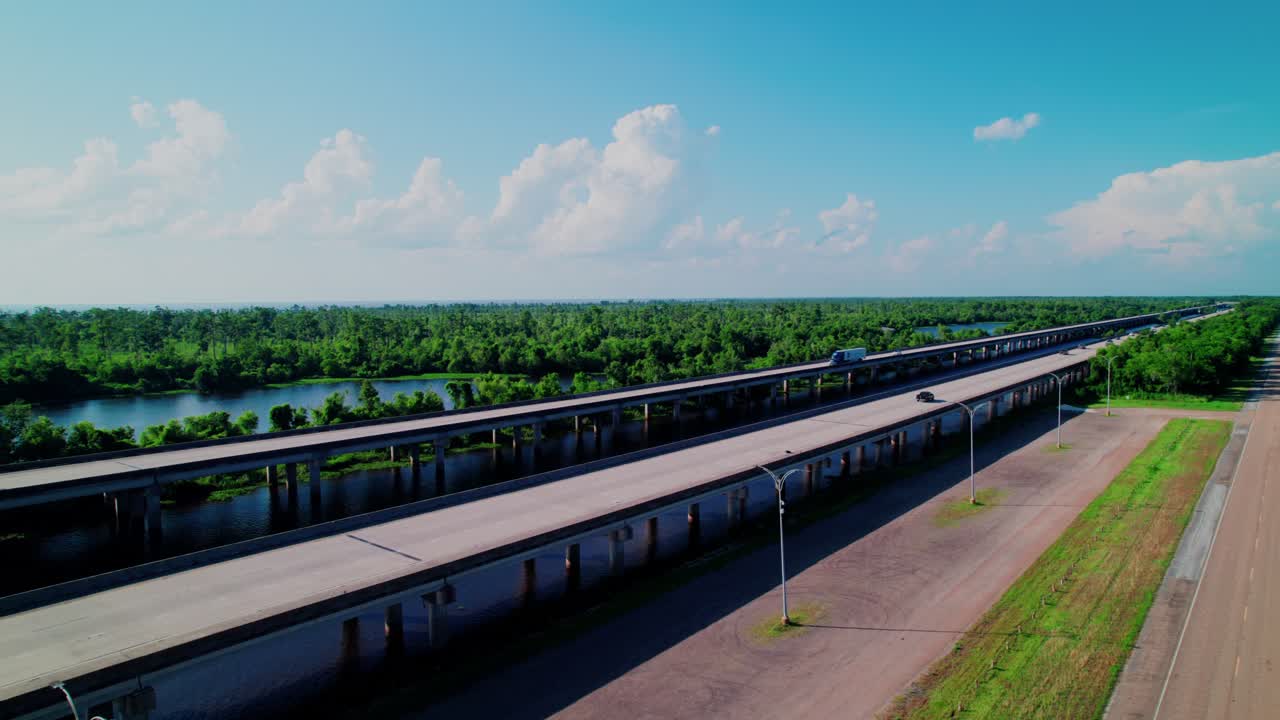Louisiana wetlands with a highway bridge spanning rivers, highlighting the ecosystem
