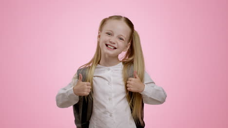 happy schoolgirl with thumbs up