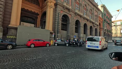 police vehicles and officers in urban naples setting