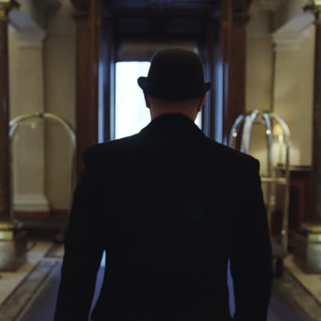 gentleman walking in a hall