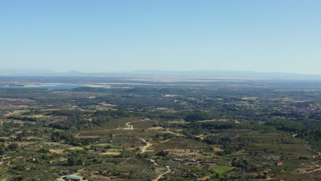aerial drone view of the tiétar valley in the area where we visualize the rosarito reservoir, in this part we appreciate the width of the valley, in the background you can see the mountains.