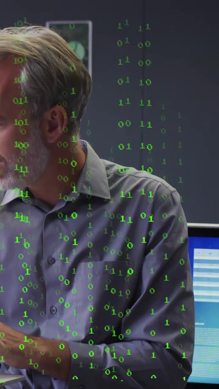 IT pro using laptop analyzing UI on blue monitor after green binary code appearing and cascading