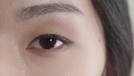 close-up-beautiful-asian-woman-eye-opening-looking-at-camera-healthy-eyesight-feminine-beauty