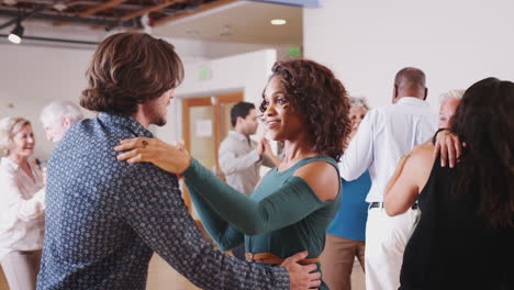 People Having Fun Attending Dance Class In Community Center