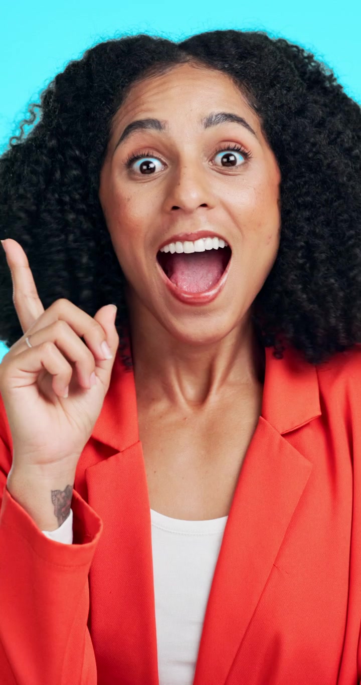 Young Woman Having an Idea and Pointing Upward