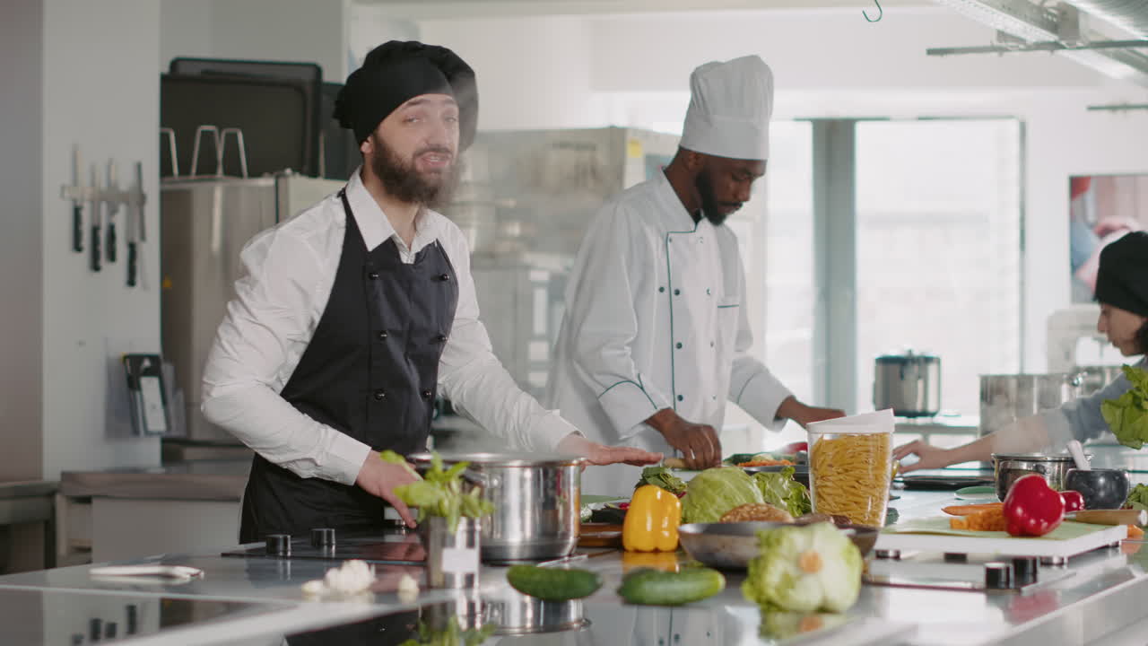 POV of male cook recording cooking show video on camera