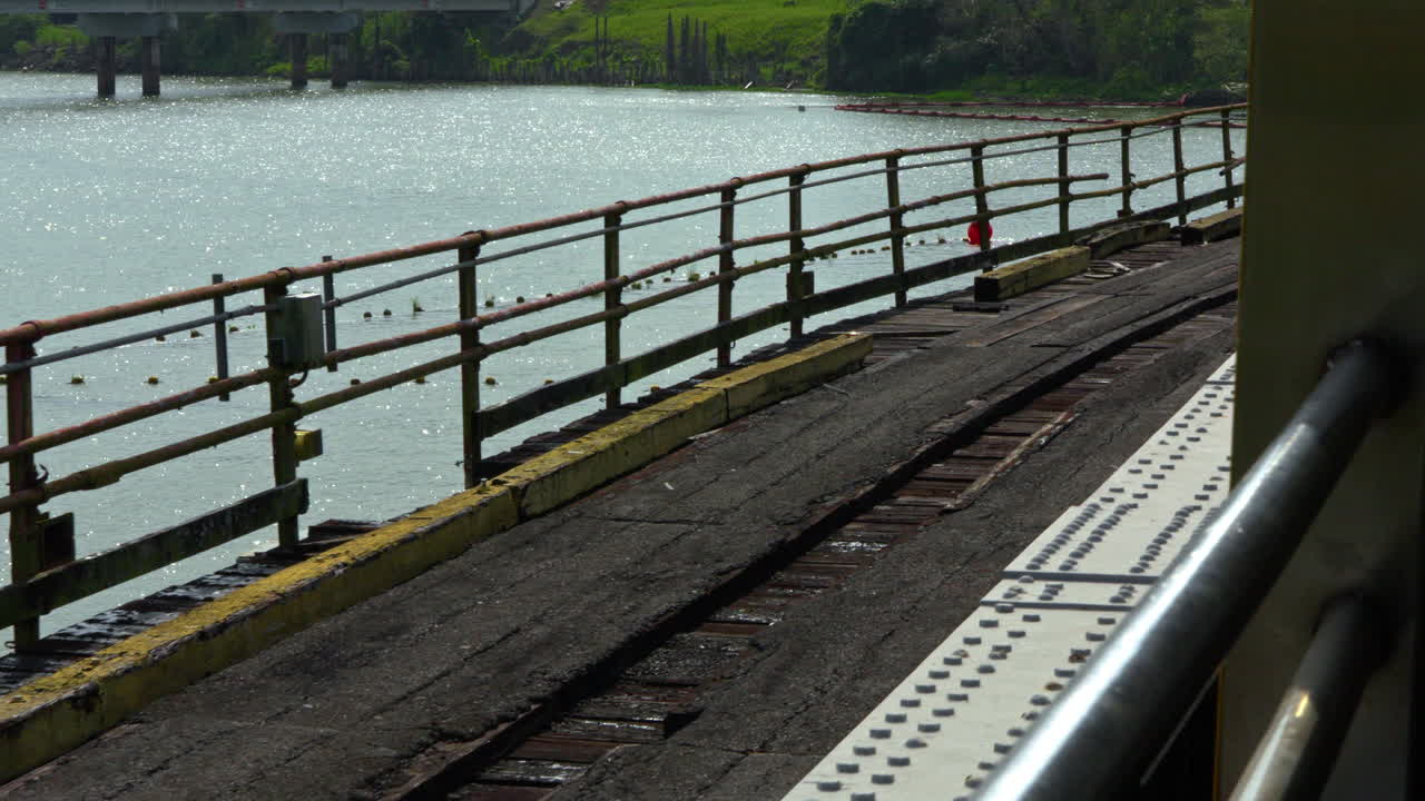 slow-motion shot crossing the Gamboa Bridge with the old tracks alongside