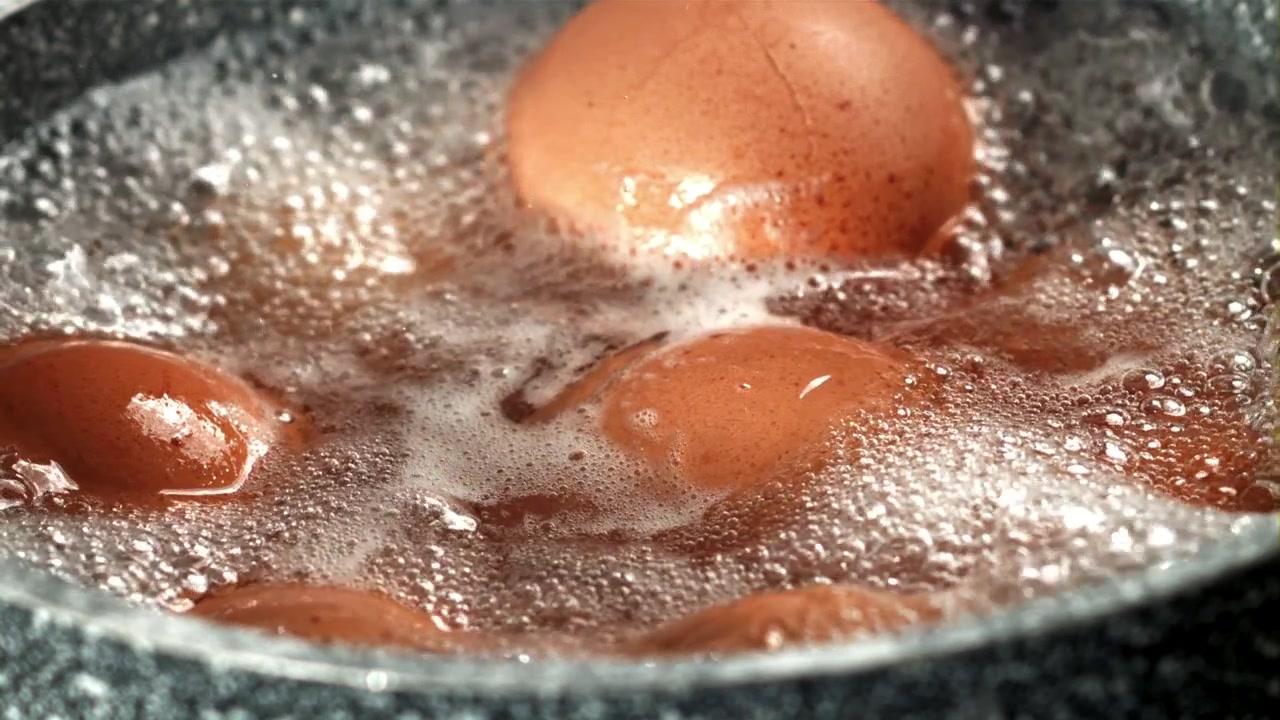 Brown Eggs Boiling in a Pot of Hot Water