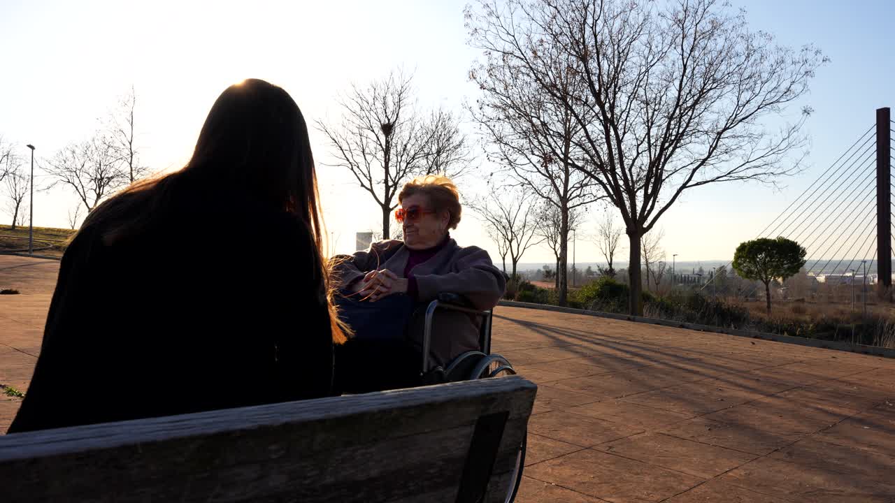 Surprised granny about what her granddaughter says in the park