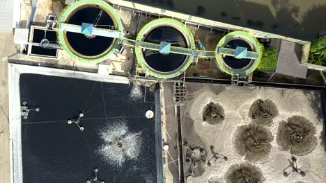 aerial top view 4k of waste water treatment system in industrial estate