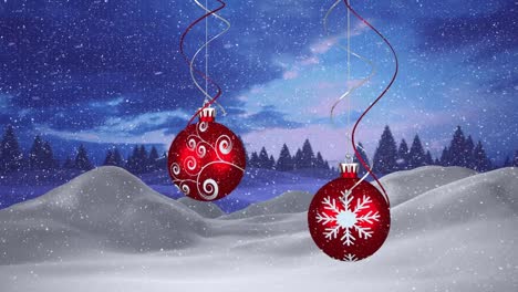 Animation-of-snow-falling-over-red-christmas-baubles-decorations
